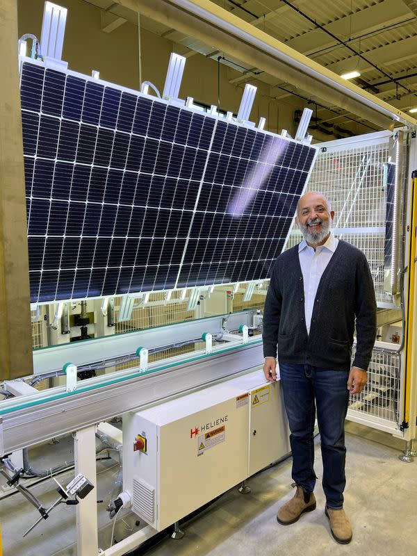 Heliene CEO Martin Pochtaruk poses at the company's solar panel factory in Iron Mountain