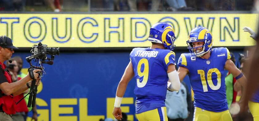 Rams quarterback Matthew Stafford (9) congratulates Cooper Kupp for his touchdown catch.