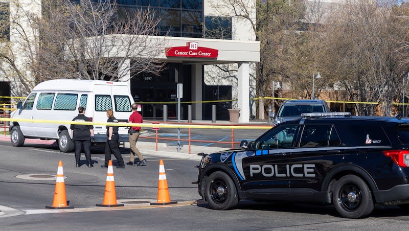 A police vehicle is parked outside Saint Alphonsus Regional Medical Center in Boise, Idaho, on Wednesday, March 20, 2024. Idaho police are searching for a state’s prison inmate and alleged accomplice after three state Department of Corrections officials were injured as the inmate and his accomplice fled from the Boise hospital.