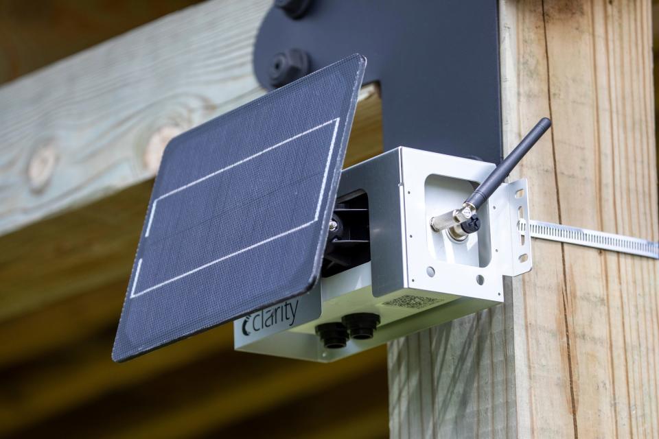 An air quality monitor is temporarily strapped to a shelter in the East Canfield art park in Detroit.