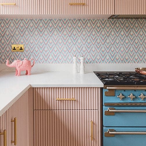 Tabitha's bespoke fluted pink cabinet doors in the kitchen - Emma Lewis