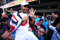 <p>Lewis Hamilton celebrates winning the Formula One drivers’ championship for a fifth time at the Circuit of the Americas in Mexico. Hamilton won 11 of the 21 grands prix in 2018, although his championship win was sealed by a fourth-placed finish in Mexico behind Max Verstappen (PA). </p>