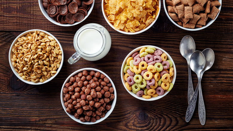 Six bowls of cereal with milk