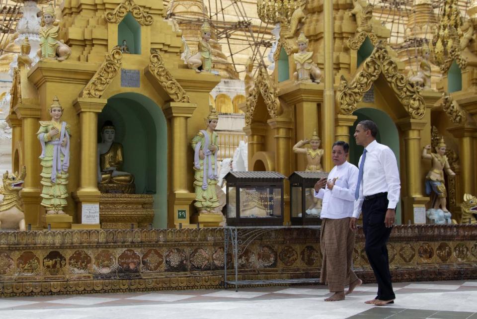 FILE - This Nov. 19, 2012 file photo shows U.S. President Barack Obama touring the Shwedagon Pagoda in Yangon, Myanmar. Myanmar is on many lists as a hotspot for travel in 2013, including the U.S. Tour Operators Association, whose active members ranked the country No. 1 on a list of "off the beaten path" destinations for the new year. (AP Photo/Carolyn Kaster, file)