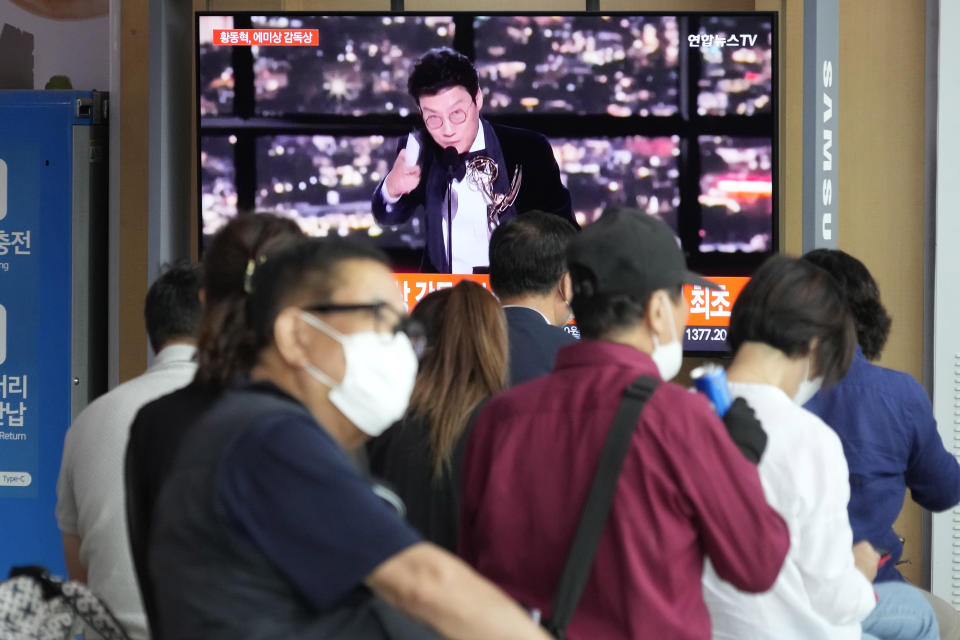 A TV screen shows the Squid Game's director Hwang Dong-hyuk during a news program at the Seoul Railway Station in Seoul, South Korea, Tuesday, Sept. 13, 2022. (AP Photo/Ahn Young-joon)