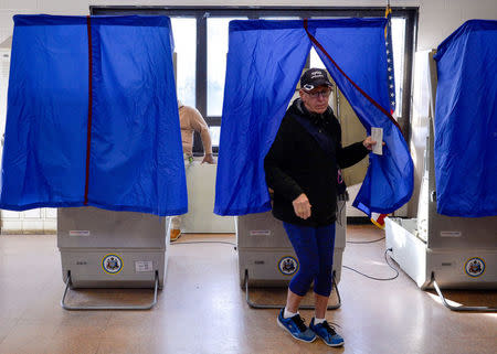 FILE PHOTO: A voter leaves the polling booth during the U.S. presidential election in Philadelphia, Pennsylvania, U.S. November 8, 2016. REUTERS/Charles Mostoller/File Photo