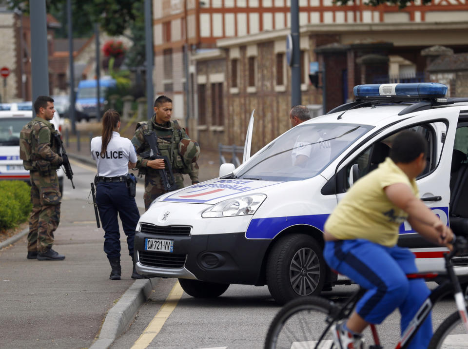 <p>French soldiers and a police officer stand guard as they prevent the access to the scene of an attack in Saint Etienne du Rouvray, Normandy, France, Tuesday, July 26, 2016. (AP Photo/Francois Mori)</p>