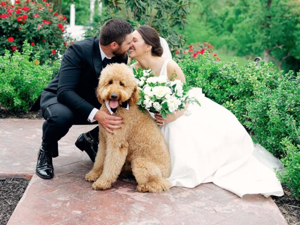 Garrett Stuteville and their dog Arlo at a wedding