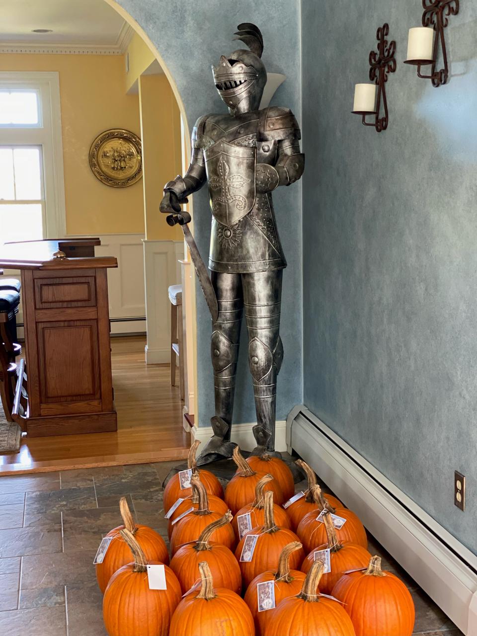 Previous owners Bill and Kristin DiCroce, of Falmouth, had a knight placed in a corner of the foyer to greet visitors to the former carriage house of the 19th-century Pope estate in Cohasset. It is now a private home.