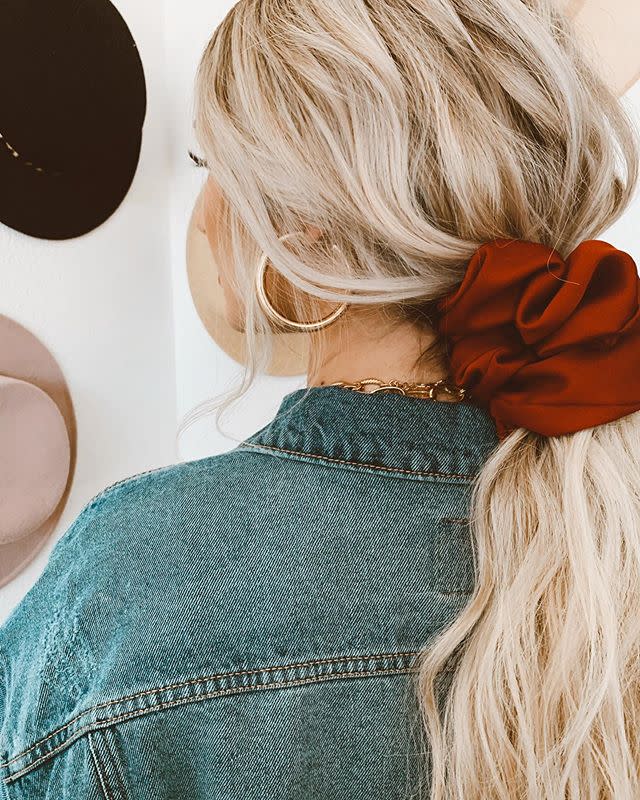 <p>You didn’t really think scrunches were over, did you? The party’s just getting started! There's really no better way to quickly and <strong>easily improve a basic ponytail than with a <a href="https://go.redirectingat.com?id=74968X1596630&url=https%3A%2F%2Fwww.selfridges.com%2FUS%2Fen%2Fcat%2Froop-mellisa-oversized-satin-scrunchie_R03639220%2F&sref=https%3A%2F%2Fwww.cosmopolitan.com%2Fstyle-beauty%2Fbeauty%2Fg33523650%2Fwinter-2020-hair-trends%2F" rel="nofollow noopener" target="_blank" data-ylk="slk:scrunchie;elm:context_link;itc:0;sec:content-canvas" class="link ">scrunchie</a></strong>, so keep one on your wrist for whenever you need it. You'll be glad to have one handy with the winter winds pick up, trust.</p><p><a href="https://www.instagram.com/p/B_yAMiqn1KC/?utm_source=ig_embed&utm_campaign=loading" rel="nofollow noopener" target="_blank" data-ylk="slk:See the original post on Instagram;elm:context_link;itc:0;sec:content-canvas" class="link ">See the original post on Instagram</a></p>