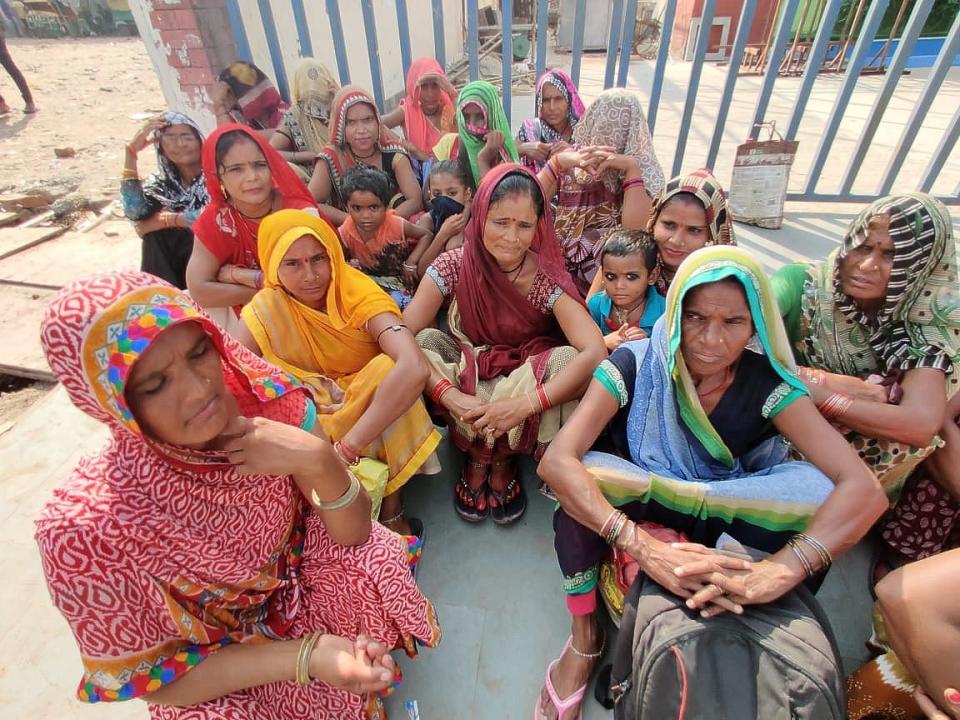 Women waiting at Noida’s labour chowk with their kids.