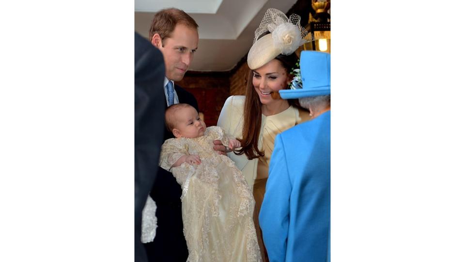 Queen Elizabeth II with Prince William and his wife Catherine at their son Prince George's christening 