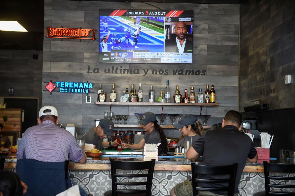 Customers enjoy food during the opening day of Lokos Tacos off Washington Road on Monday, Oct. 3, 2022. 