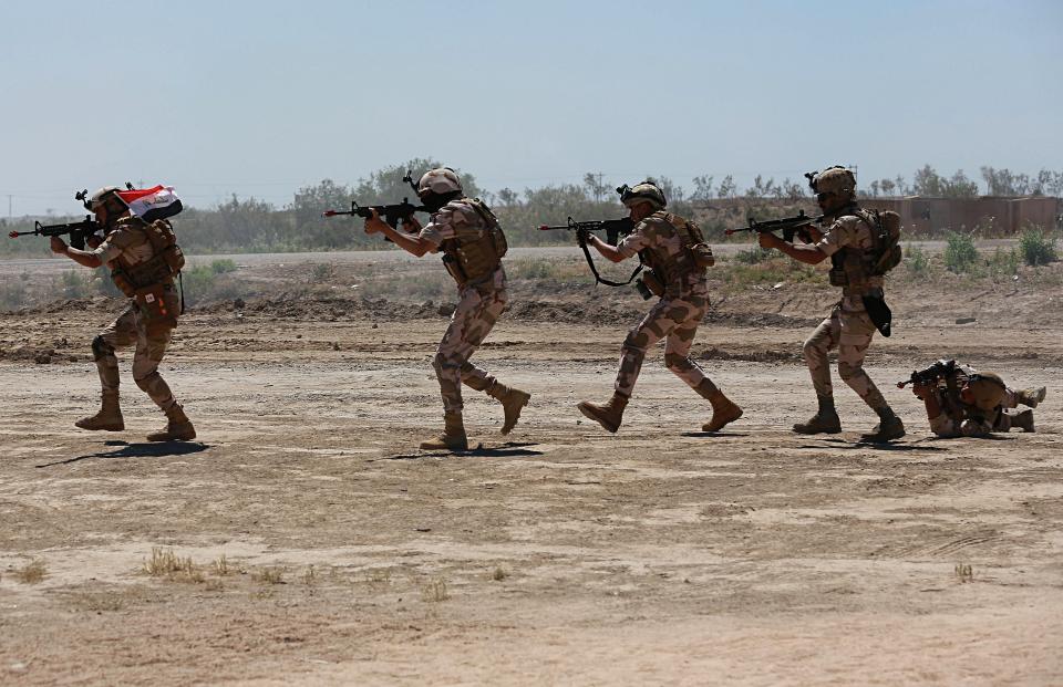 Australian and New Zealand coalition forces participate in a training mission with Iraqi army soldiers at Taji Base, north of Baghdad, Iraq, Wednesday, April 17, 2019. A month after the defeat of the Islamic State group in Syria and Iraq, the U.S.-led international coalition has turned its attention to training Iraqi forces to secure the country against lingering threats posed by IS cells operating in the countryside. (AP Photo/Hadi Mizban)