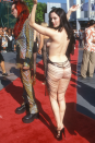 <p>Rose McGowan wow-ed at the 1998 MTV Video Music Awards (home of <a href="https://www.cosmopolitan.com/uk/fashion/celebrity/g4122/vmas-outrageous-outfits-ever-red-carpet-photos/" rel="nofollow noopener" target="_blank" data-ylk="slk:bold naked dresses;elm:context_link;itc:0" class="link ">bold naked dresses</a>) wearing this barely-there dress with beaded strings across the back.</p>