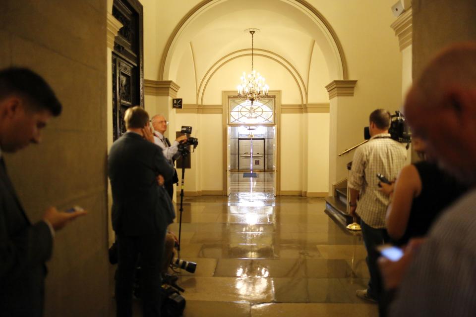 Journalists wait for Boehner to arrive at the U.S. Capitol in Washington