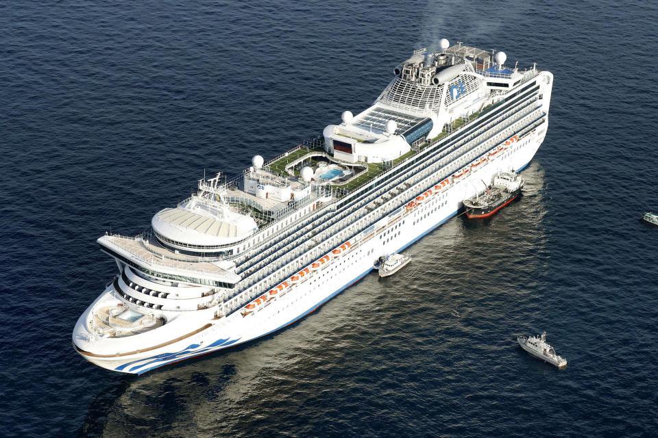 Cruise ship Diamond Princess is anchored off the shore of Yokohama, south of Tokyo, Wednesday, Feb. 5, 2020. Japan said Wednesday 10 people on the cruise ship have tested positive for a new virus and were being taken to hospitals. Health Minister Nobukatsu Kato said all the 3,700 people and passengers on the ship will be quarantined on board for up to 14 days under Japanese law. (Hiroko Harima/Kyodo News via AP)