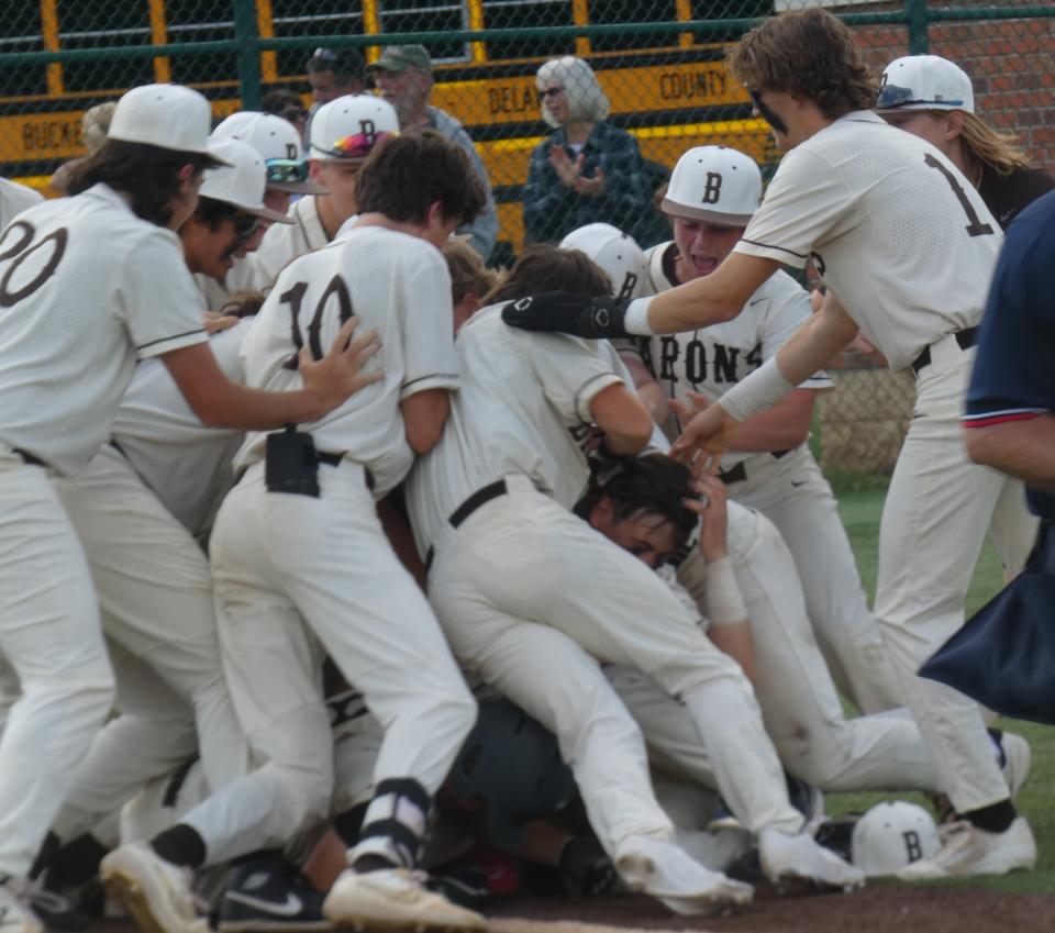 Buckeye Valley players celebrate after scoring the winning run in the bottom of the 10th inning against Johnstown ​during a Division II district final at Mount Vernon Nazarene on Saturday, May 28, 2022. The Barons rallied to beat Johnstown 5-4.
​