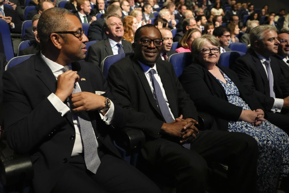 From left, Britain's Foreign Secretary James Cleverly, Britain's Chancellor of the Exchequer Kwasi Kwarteng and Health Secretary Therese Coffey wait for Britain's Prime Minister Liz Truss to make a speech at the Conservative Party conference at the ICC in Birmingham, England, Wednesday, Oct. 5, 2022. (AP Photo/Kirsty Wigglesworth)