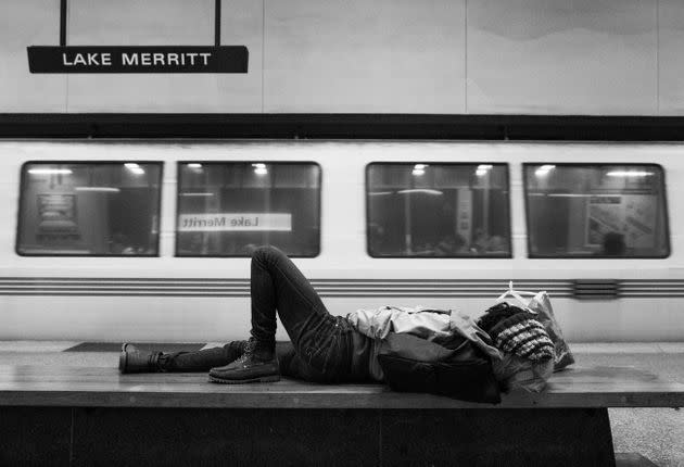 A homeless woman sleeps on a bench at a BART station in Oakland, California. Telling the story of contemporary violence against Black women and girls means taking stock of the ways we routinely harm those on the margins. (Photo: Jessica Christian/San Francisco Chronicle via Getty Images)