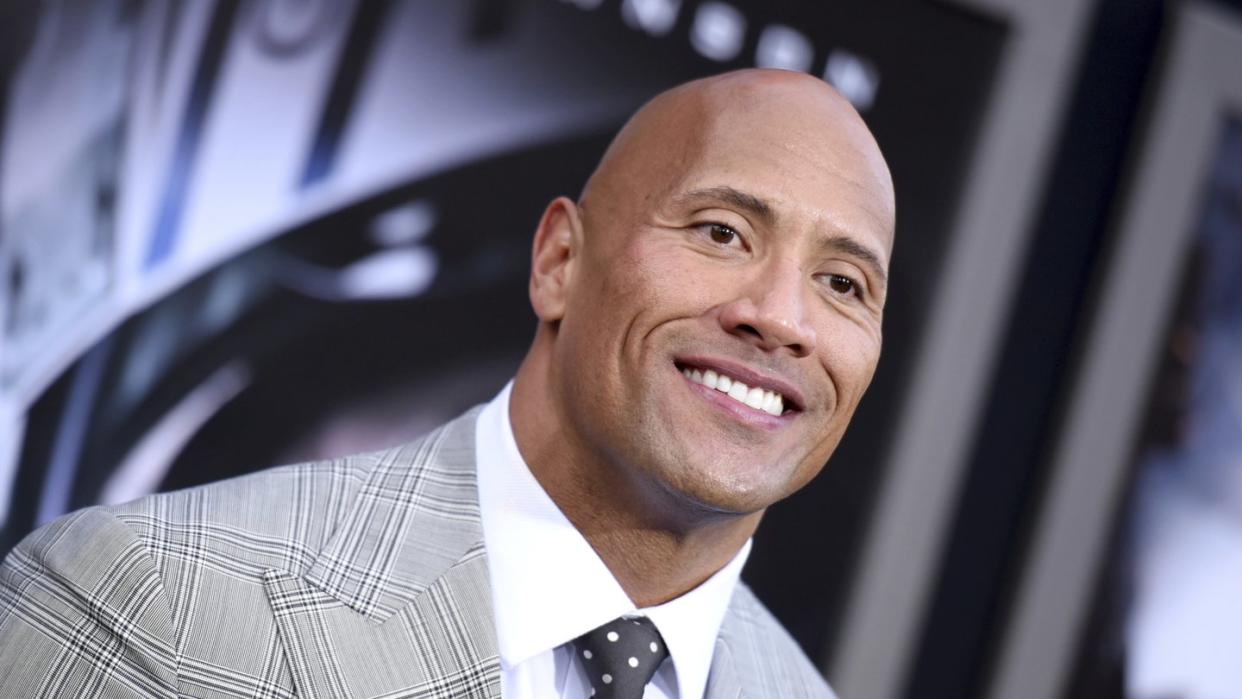 US-Schauspieler Dwayne Johnson freut sich über sein kleines Mädchen. Foto: Richard Shotwell/Invision/AP