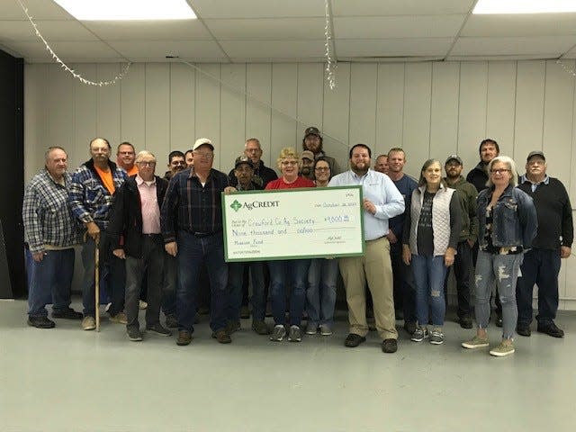 AgCredit representatives recently presented members of the Crawford County Agricultural Society a $9,000 Mission Fund grant.