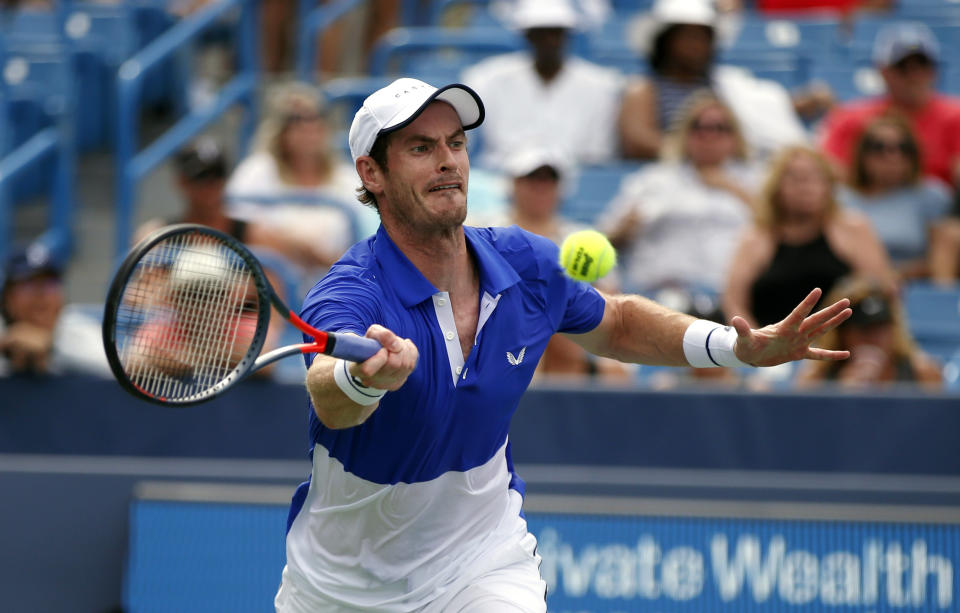 Andy Murray, of Britain, returns a shot against Richard Gasquet, of France, during first-round play at the Western & Southern Open tennis tournament Monday, Aug. 12, 2019, in Mason, Ohio. (AP Photo/Gary Landers)