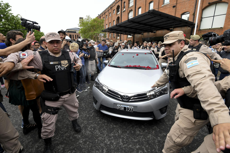 The car carrying Alberto Fernandez, presidential candidates for the "Frente para Todos" coalition, leave a polling station after he voted in Buenos Aires, Argentina, Sunday, Oct. 27, 2019. Argentina could take a political turn in Sunday's presidential elections, with center-left Peronist candidate Fernandez favored to oust conservative incumbent Mauricio Macri amid growing frustration over the country's economic crisis. (AP Photo/Gustavo Garello)