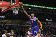 New York Knicks' Obi Toppin (1) goes up for a shot during the first half of a NBA basketball game against the Chicago Bulls Sunday, Nov. 21, 2021 in Chicago. (AP Photo/Paul Beaty)