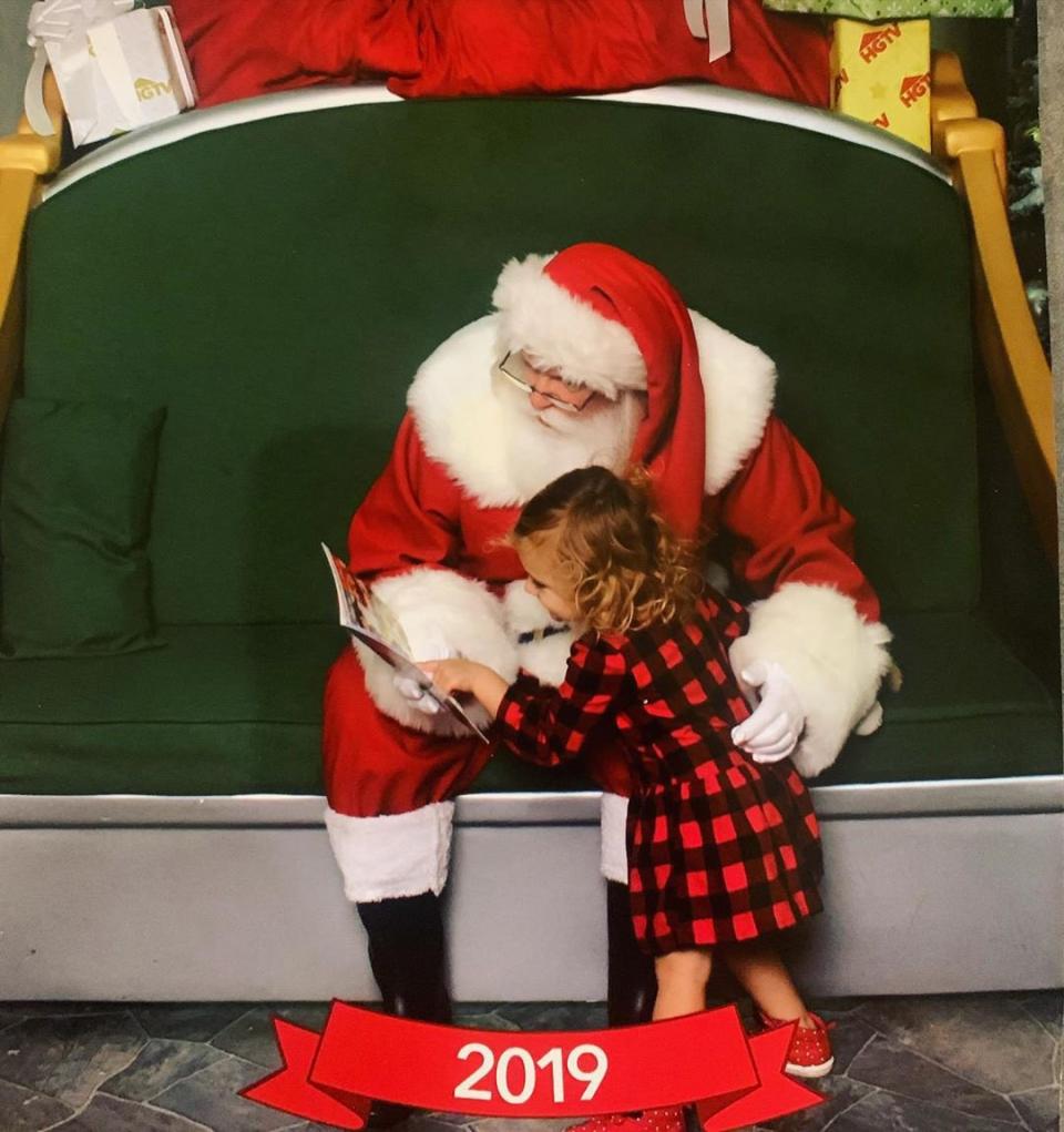 "Wasn’t feeling Santa’s lap this year but Bird is always up for a book!!!" retired WWE star Brie Bella <a href="https://www.instagram.com/p/B5sjfhnhWZT/" rel="nofollow noopener" target="_blank" data-ylk="slk:captioned;elm:context_link;itc:0;sec:content-canvas" class="link ">captioned</a> her photo of daughter <a href="https://people.com/parents/brie-bella-daniel-bryan-welcome-daughter-birdie-joe/" rel="nofollow noopener" target="_blank" data-ylk="slk:Birdie Joe Danielson;elm:context_link;itc:0;sec:content-canvas" class="link ">Birdie Joe Danielson</a> reading with the man of the season. "Smart move Santa!!! 📚🎅🏼❤️ #mylittlereader," Bella added.