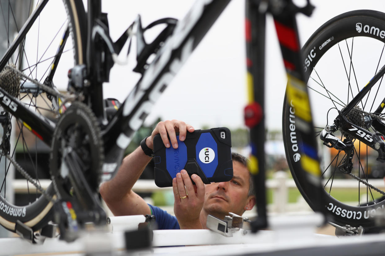  A UCI inspector examines bikes to detect hidden motors ahead of stage four of Le Tour de France from Saumar to Limoges on July 5, 2016 