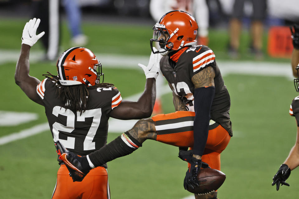 Cleveland Browns wide receiver Odell Beckham Jr., right, celebrates with running back Kareem Hunt after Beckham's touchdown during the first half of the team's NFL football game against the Cincinnati Bengals, Thursday, Sept. 17, 2020, in Cleveland. (AP Photo/Ron Schwane)