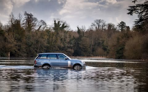 Range Rover in a lake  - Credit: David Shepherd