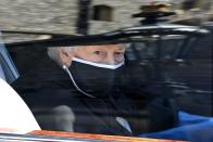 <p>The queen is photographed arriving in her car. </p>