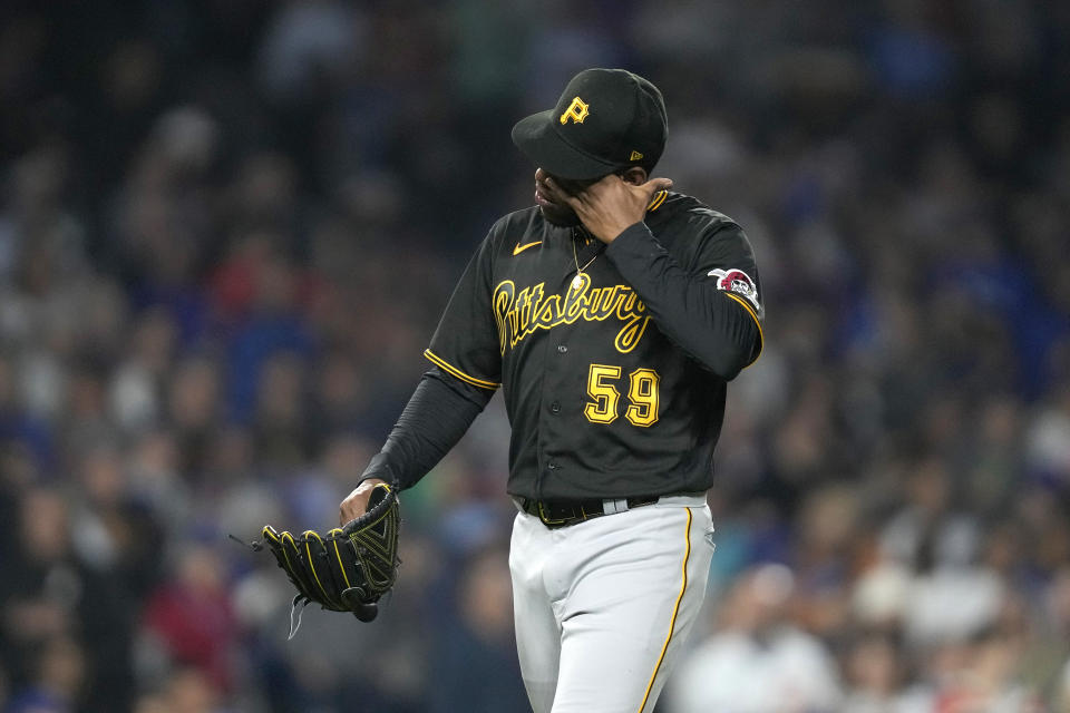 Pittsburgh Pirates relief pitcher Roansy Contreras heads to the dugout after being pulled in the sixth inning of the team's baseball game against the Chicago Cubs on Wednesday, June 14, 2023, in Chicago. (AP Photo/Charles Rex Arbogast)