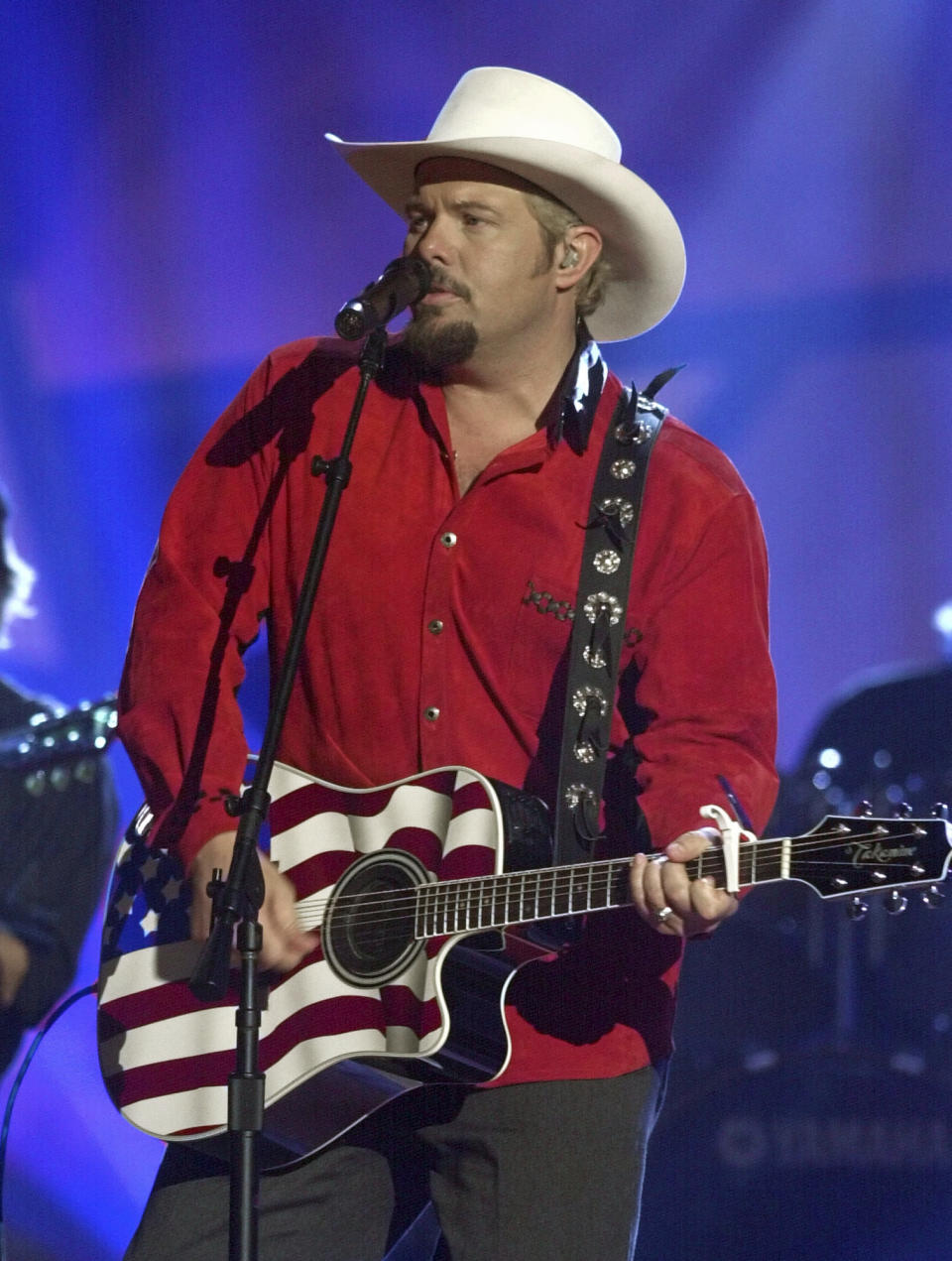 FILE - Country singer Toby Keith performs his song "Courtesy Of The Red, White And Blue (The Angry American)," on June 12, 2002, in Nashville, Tenn. Keith, who died on Monday, Feb. 5, 2024, of cancer at age 62, is being celebrated for his immense catalog of songs. But his 2002 track “Courtesy Of The Red, White And Blue (The Angry American)" may be remembered most. (AP Photo/Mark Humphrey, File)