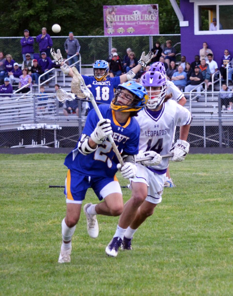 Liberty's Jonah Rohrer, left, tries to gain control of the ball against Smithsburg's Blake Linn during their Maryland Class 1A state quarterfinal game at Smithsburg.