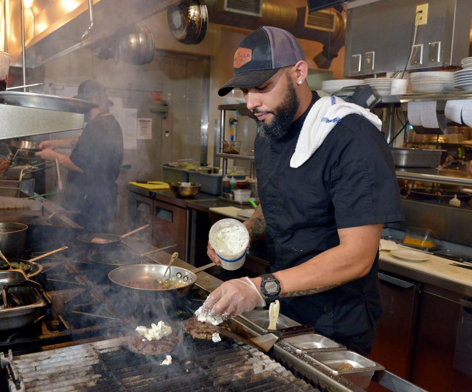 Chef Edward Lordman manages the food preparations at Polanzo Bistro on Dec. 30. Lordman is competing on Food Network's "Beachside Brawl."