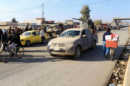 Military vehicles of the Iraqi army take part in an operation against Islamic State militants in Gogjali neighborhood in Mosul, Iraq, December 4, 2016. REUTERS/Thaier Al-Sudani