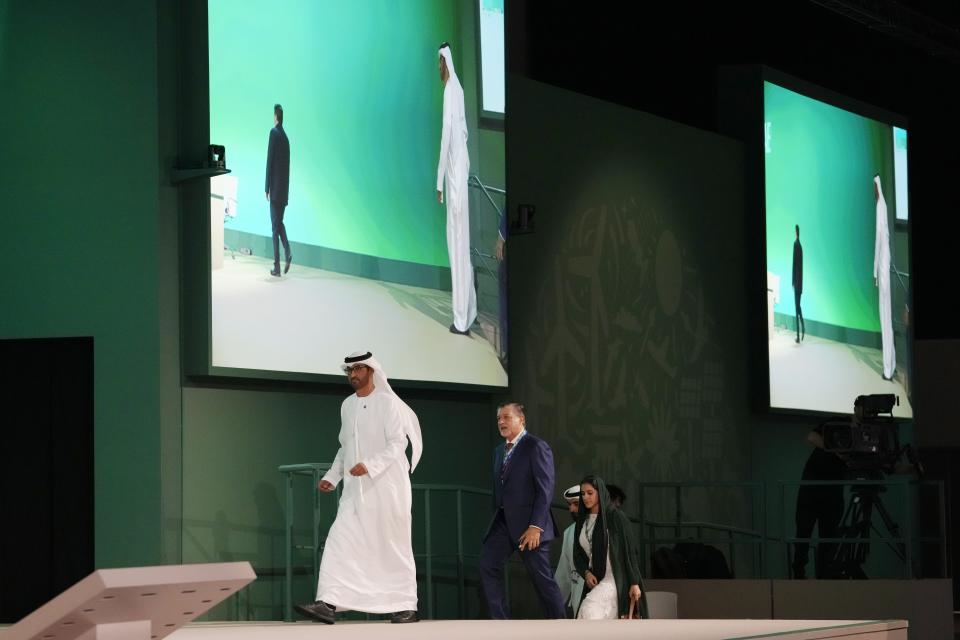 COP28 President Sultan al-Jaber walks onstage at the opening session during the COP28 U.N. Climate Summit, Thursday, Nov. 30, 2023, in Dubai, United Arab Emirates. (AP Photo/Peter Dejong)