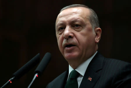 FILE PHOTO: Turkish President Tayyip Erdogan addresses members of parliament from his ruling AK Party (AKP) during a meeting at the Turkish parliament in Ankara, Turkey, March 6, 2018. REUTERS/Umit Bektas/File Photo