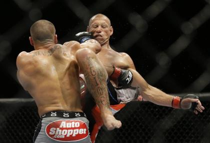 Eddie Alvarez hits Donald Cerrone during their lightweight fight. (AP)