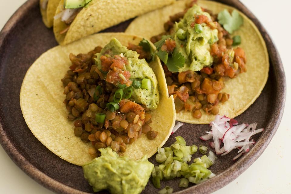 In this image taken on May 13, 2013, lentil tacos are served on a plate as seen in Concord, NH. (AP Photo/Matthew Mead)