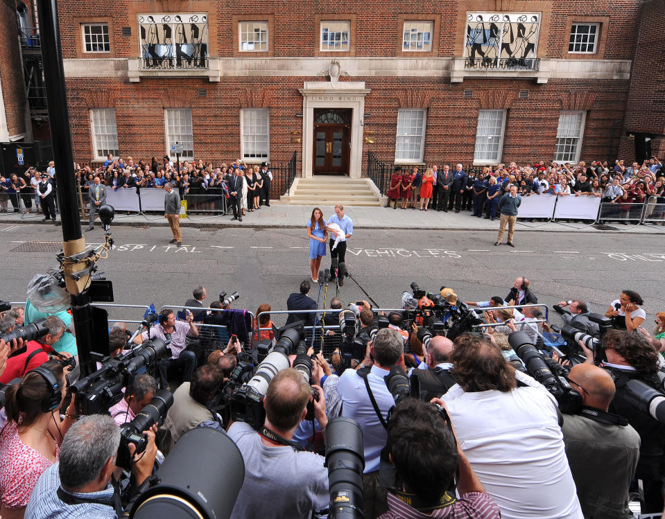 Hundreds of photographers and members of the public await the news of a royal birth [Photo: PA]