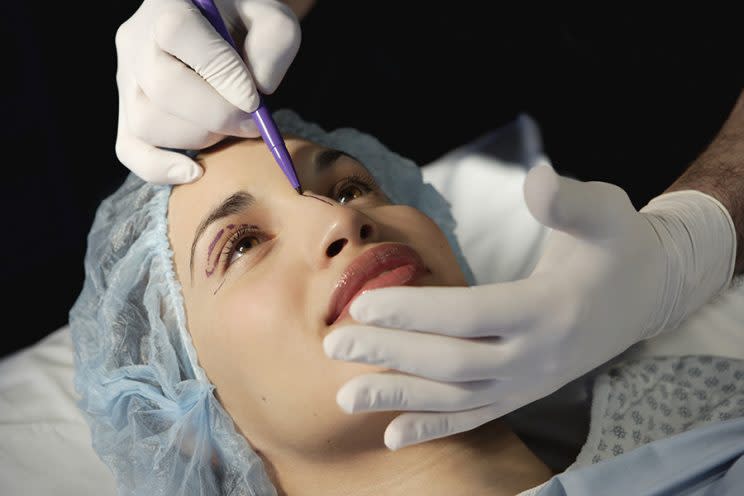 Going under the knife for a facelift may make you look more successful, younger, and healthier, according to a new study. (Photo: Getty Images)