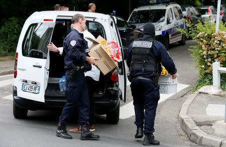 Investigators are seen during a police operation in Oullins, near Lyon, France May 27, 2019. REUTERS/Emmanuel Foudrot