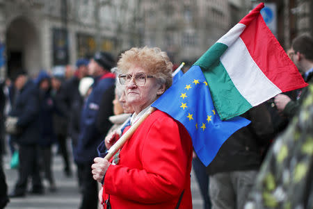 A woman protests against the government at a rally organised by opposition parties during Hungary's National Day celebrations, which also commemorates the 1848 Hungarian Revolution against the Habsburg monarchy, in Budapest, Hungary, March 15, 2019. REUTERS/Lisi Niesner