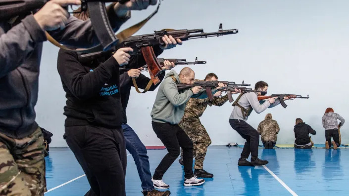 Civilians participate in a beginners combat and survival training course 