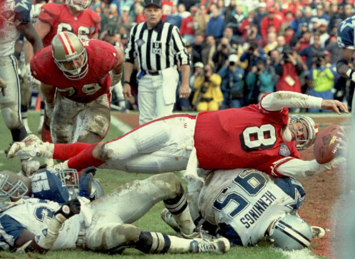 Steve Young (8) made his mark on the Cowboys-49ers rivalry with a victory in the NFC championship game following the 1994 season, and ultimately a Super Bowl XXVIX title. (John Mabanglo/AFP via Getty Images)