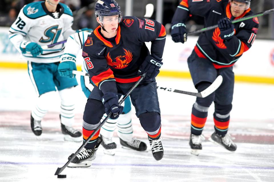 Coachella Valley Firebirds right winger Kole Lind controls the puck against San Jose Barracuda at Acrisure Arena in Palm Desert, Calif., on Monday, Feb. 27, 2023. 